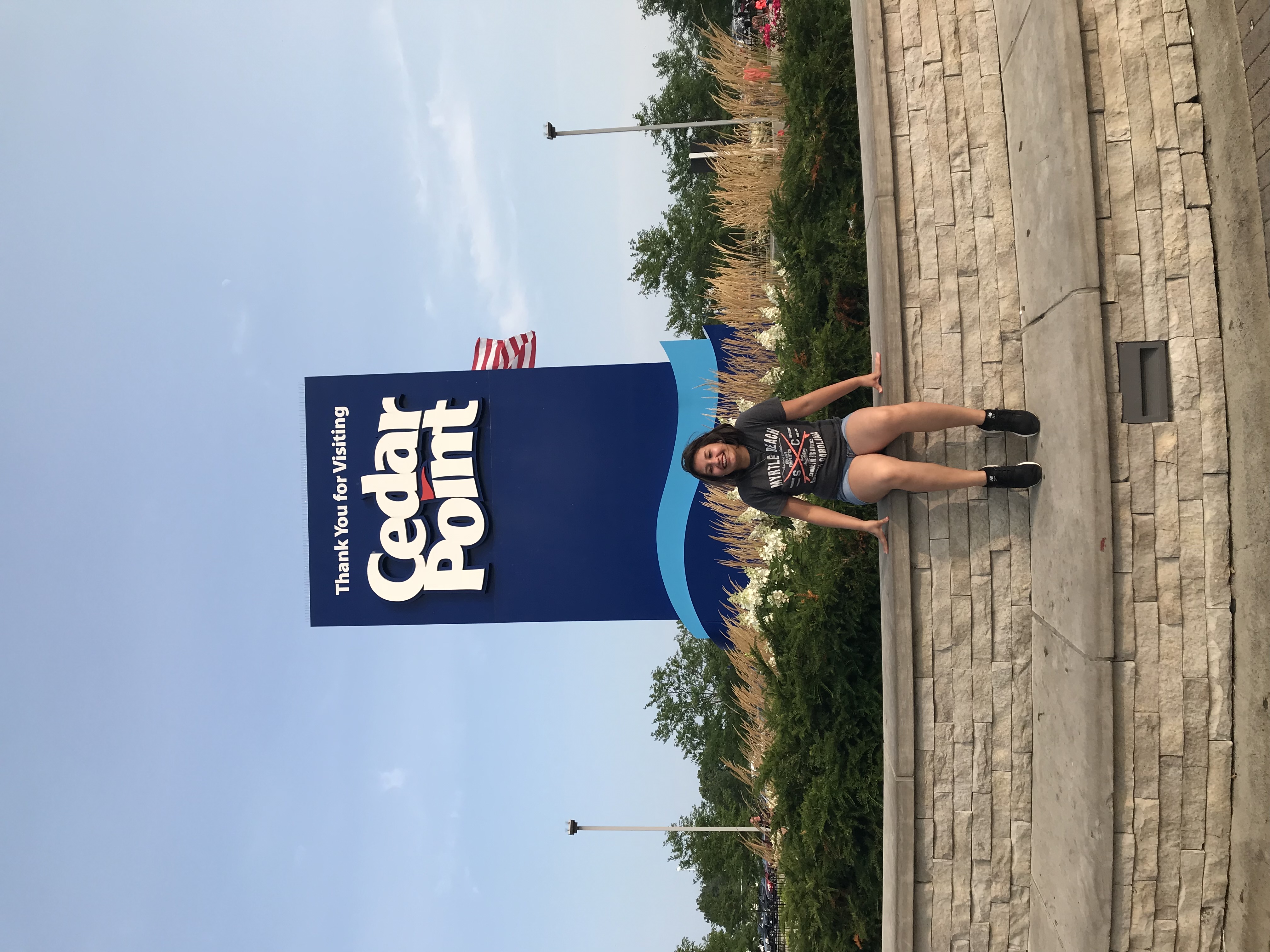 Adriana in front of Cedar Point sign