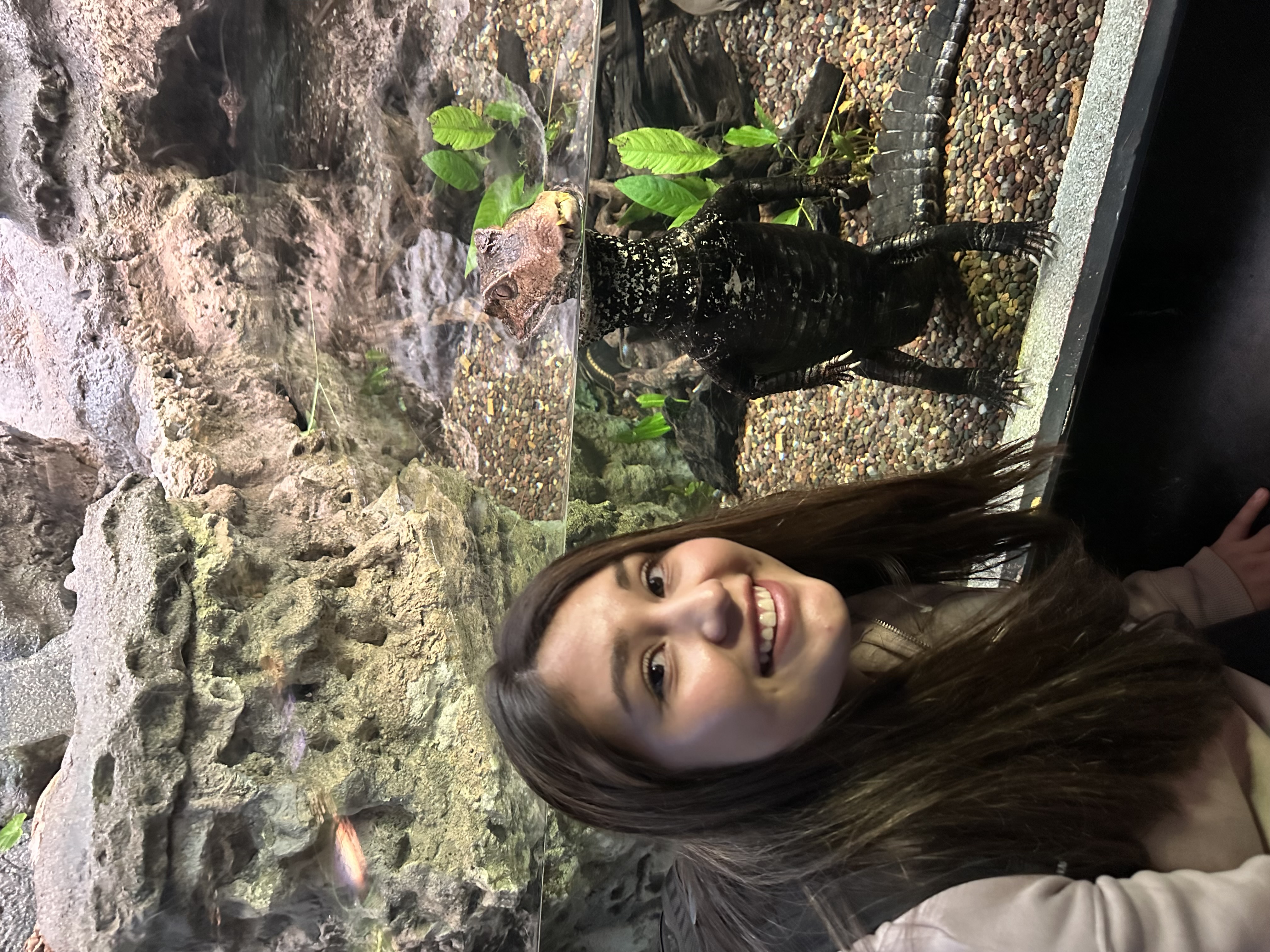 Adriana posing with caiman